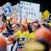 Michigan fans cheer and hold signs during a live broadcast of ESPN Game Day at Ingalls Mall on Saturday morning. Melanie Maxwell I AnnArbor.com